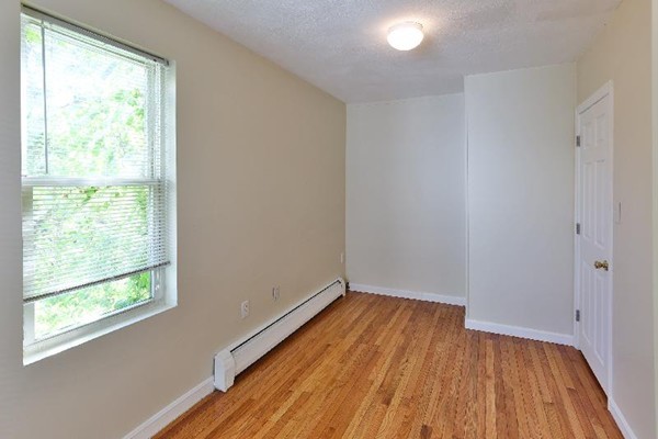 5 Everett Court Boston, MA 02128 - Photo 8 of 9 a view of a room with wooden floor and windows