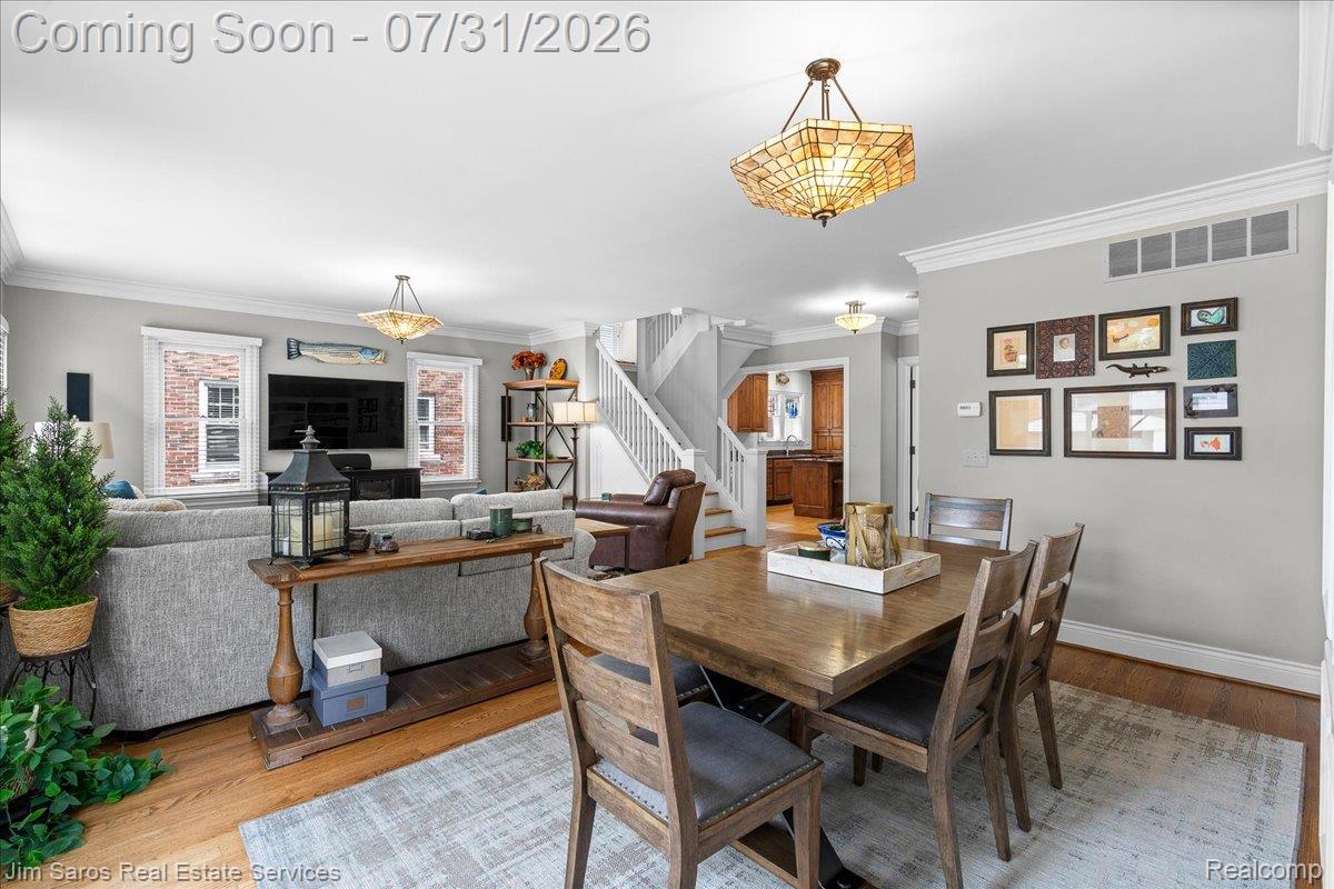 637 Washington Road Grosse Pointe, MI 48230 - Photo 10 of 40 Open-concept living and dining areas featuring hardwood flooring, crown molding, and recessed lighting