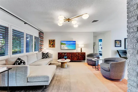a kitchen with stainless steel appliances a sink and a refrigerator