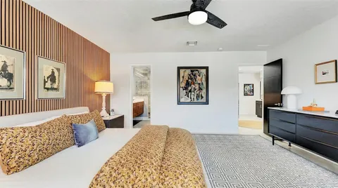 a view of a backyard with plants and patio