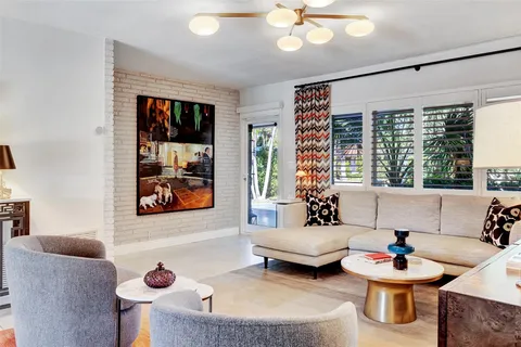 a view of a chairs and table in a backyard