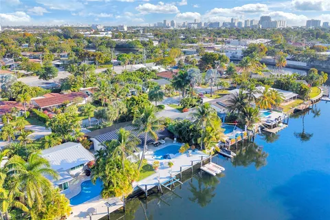 a view of a swimming pool with a yard
