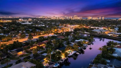 an aerial view of a houses with yard