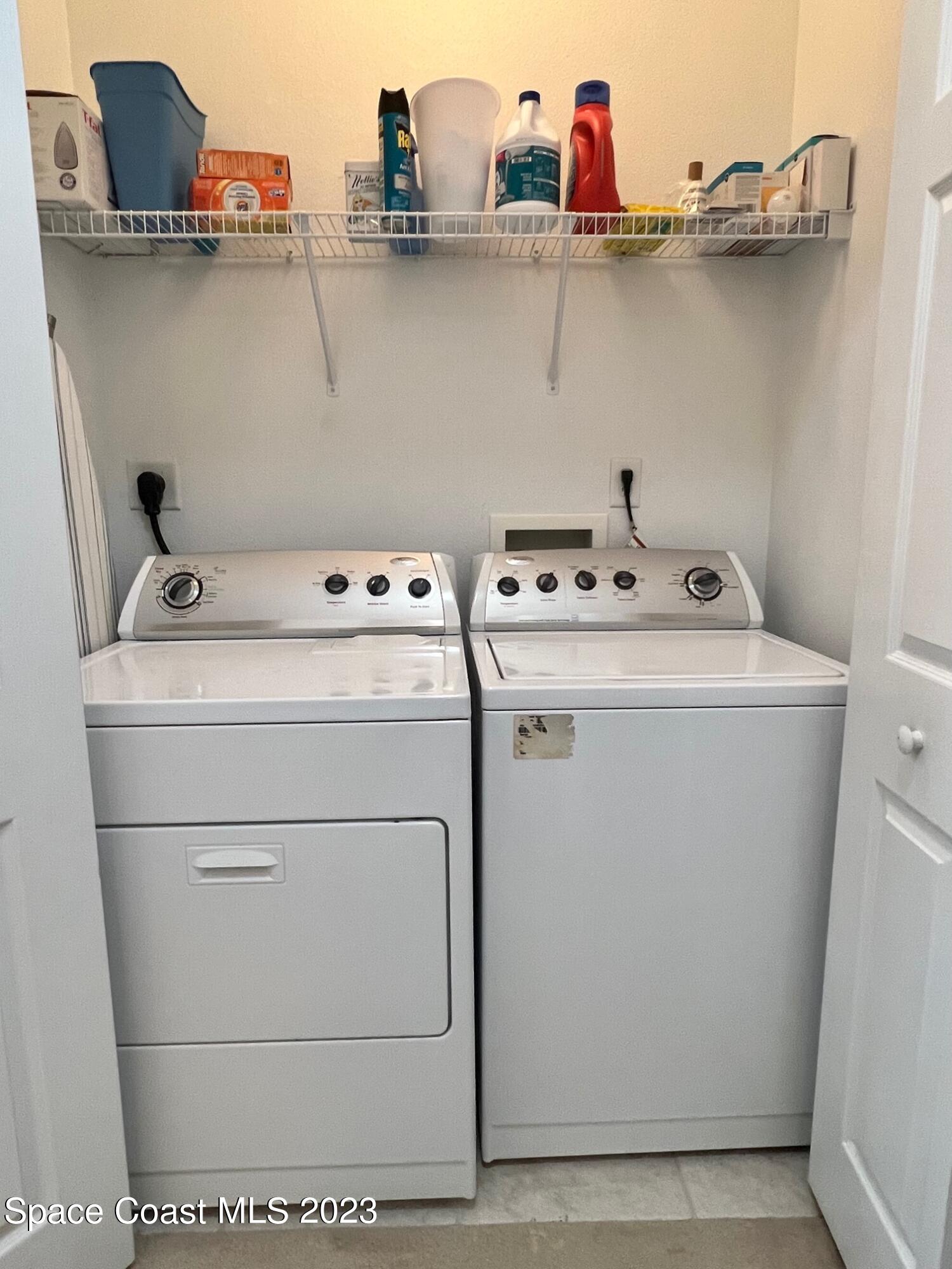 3193 Ricks Way Melbourne Beach, FL 32951 - Photo 14 of 22 a utility room with dryer and washer