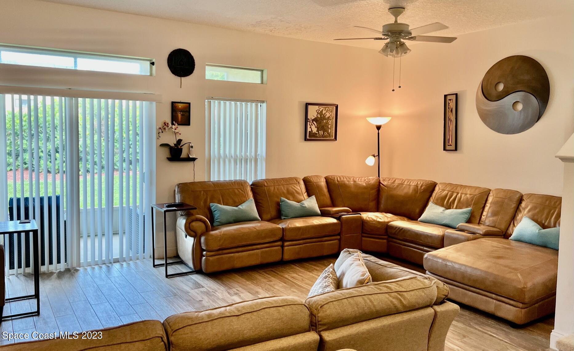 3193 Ricks Way Melbourne Beach, FL 32951 - Photo 4 of 22 a living room with furniture and a window