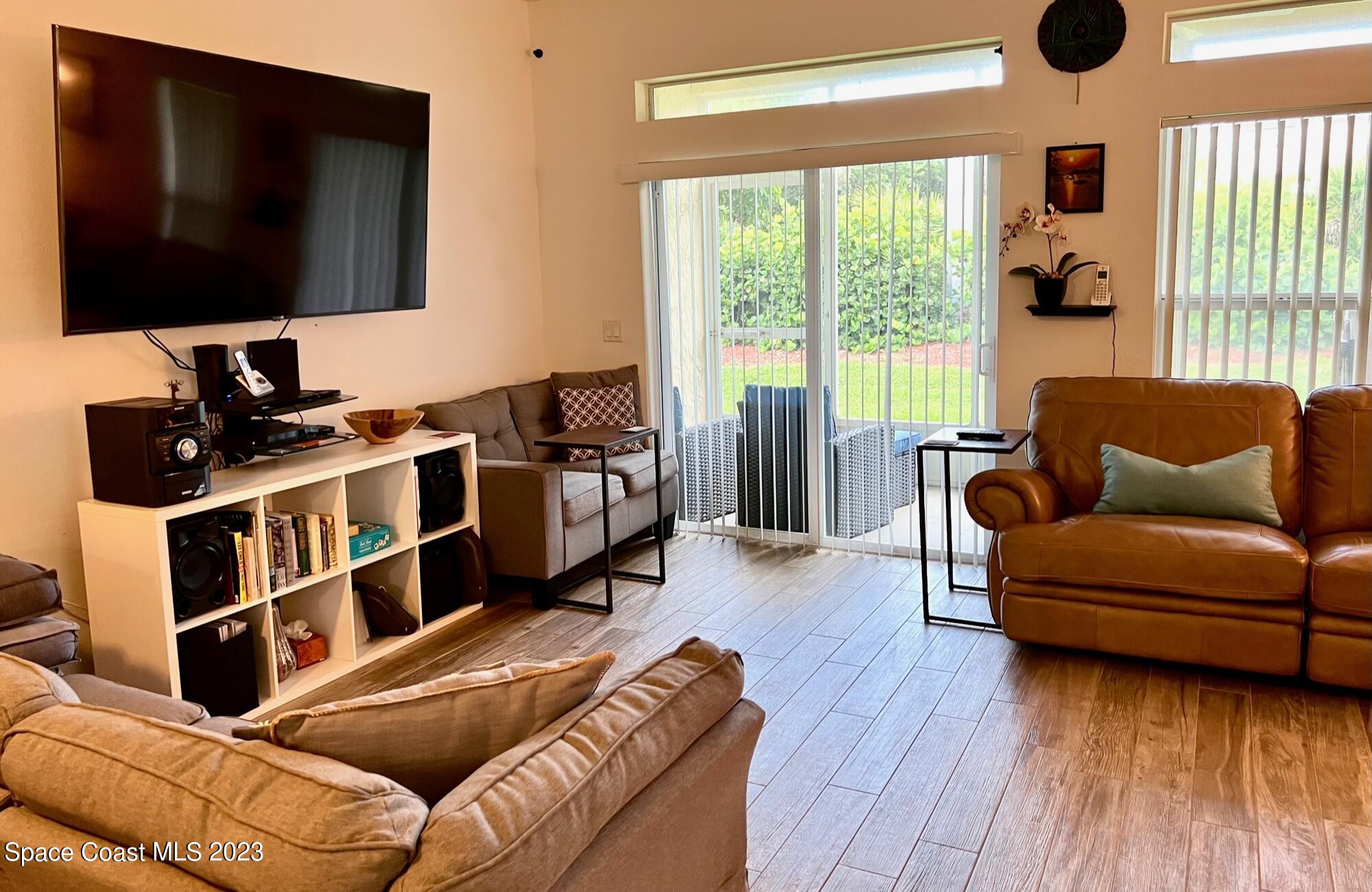 3193 Ricks Way Melbourne Beach, FL 32951 - Photo 5 of 22 a living room with furniture and a flat screen tv