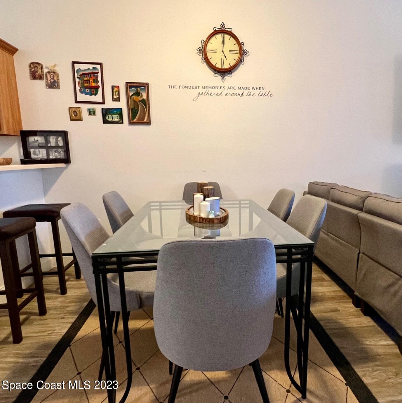 3193 Ricks Way Melbourne Beach, FL 32951 - Photo 7 of 22 a view of a dining room with furniture and wooden floor