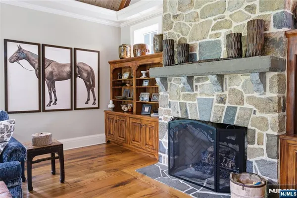 a living room with furniture a rug and a large window