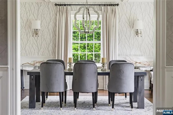 a view of a dining room with furniture and a window