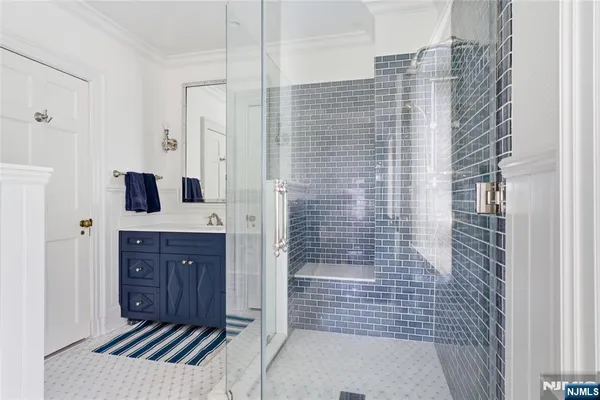 a bathroom with a shower and a sink