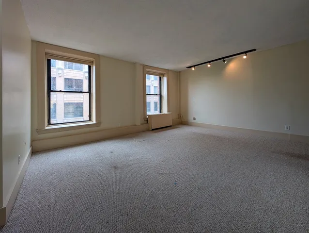 a view of empty room with windows