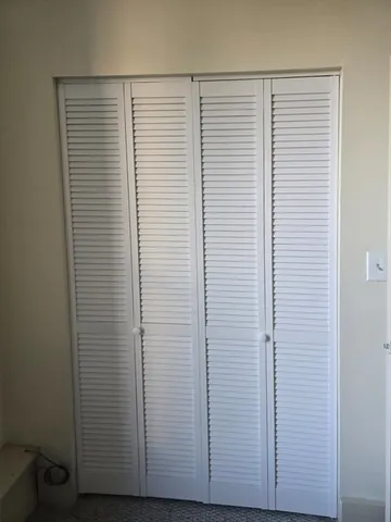 a view of a room that has a window