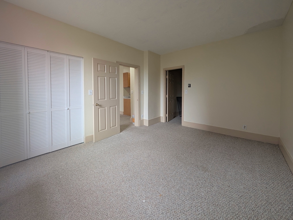 140 Chestnut Street, Unit 210 Springfield, MA 01103 - Photo 10 of 10 a view of an empty room and closet area