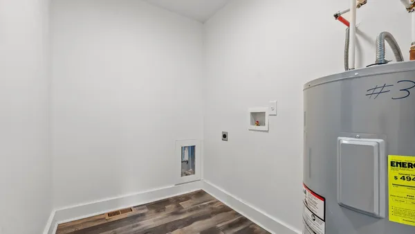 a view of storage and utility room with a sink
