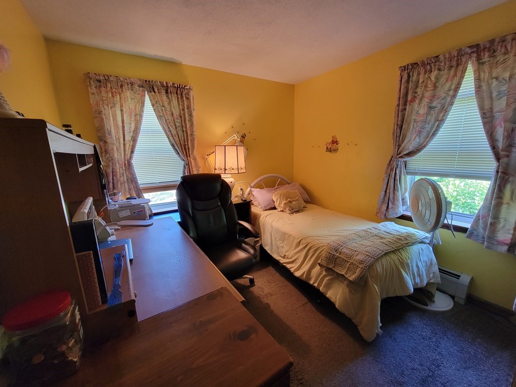 208 Old Belchertown Road Ware, MA 01082 - Photo 12 of 23 a bedroom with a bed tv and a window