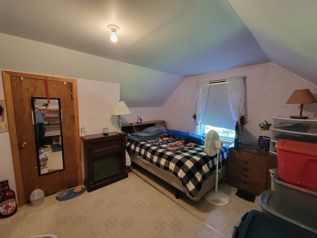 208 Old Belchertown Road Ware, MA 01082 - Photo 14 of 23 a bedroom with a bed and wooden floor