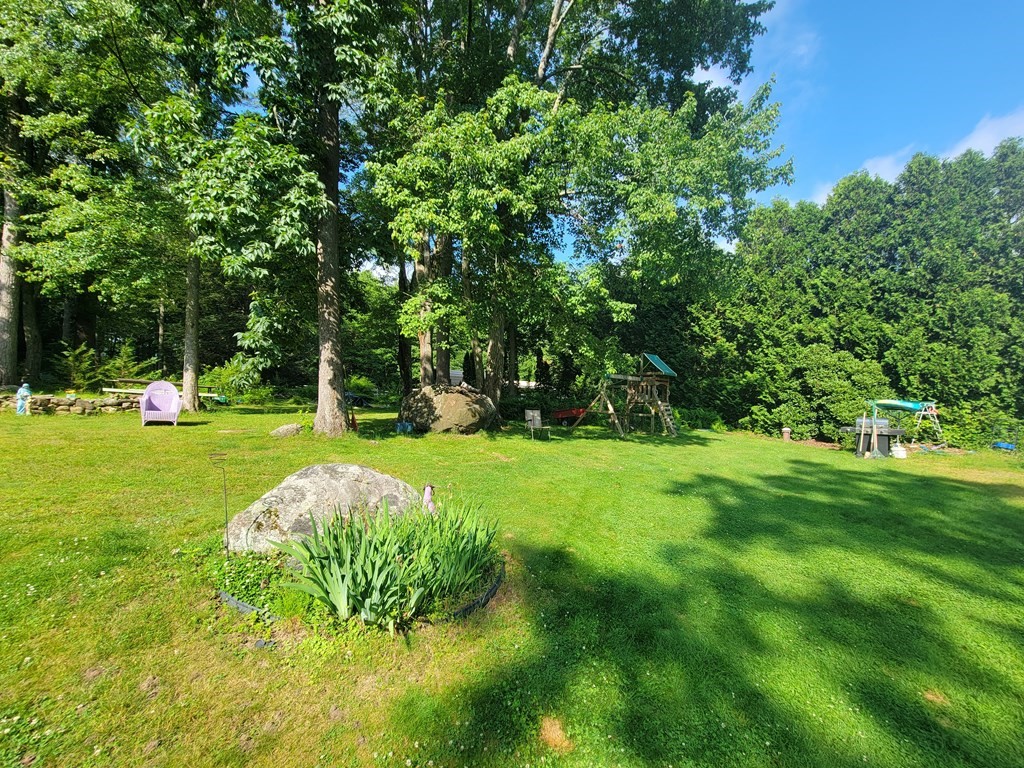 208 Old Belchertown Road Ware, MA 01082 - Photo 17 of 23 a view of a table and chairs in the garden