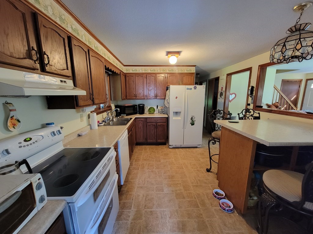 208 Old Belchertown Road Ware, MA 01082 - Photo 6 of 23 a kitchen with a sink appliances and cabinets