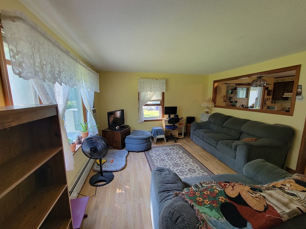 208 Old Belchertown Road Ware, MA 01082 - Photo 10 of 23 a living room with furniture and a flat screen tv