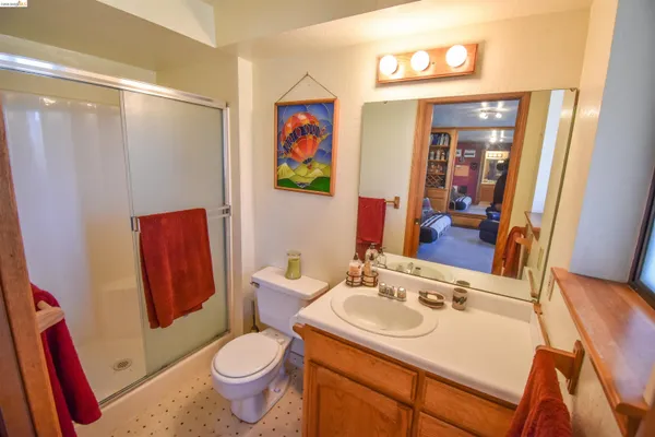 a bathroom with a sink toilet and shower