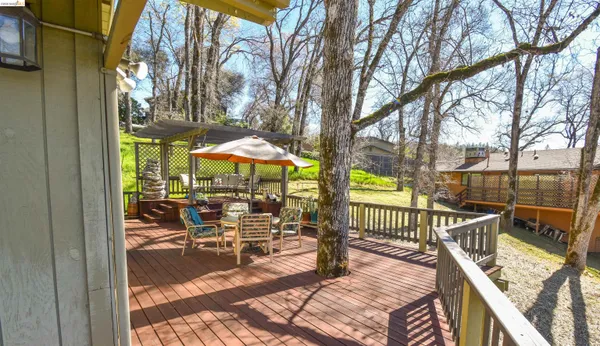 a view of a patio with iron fence