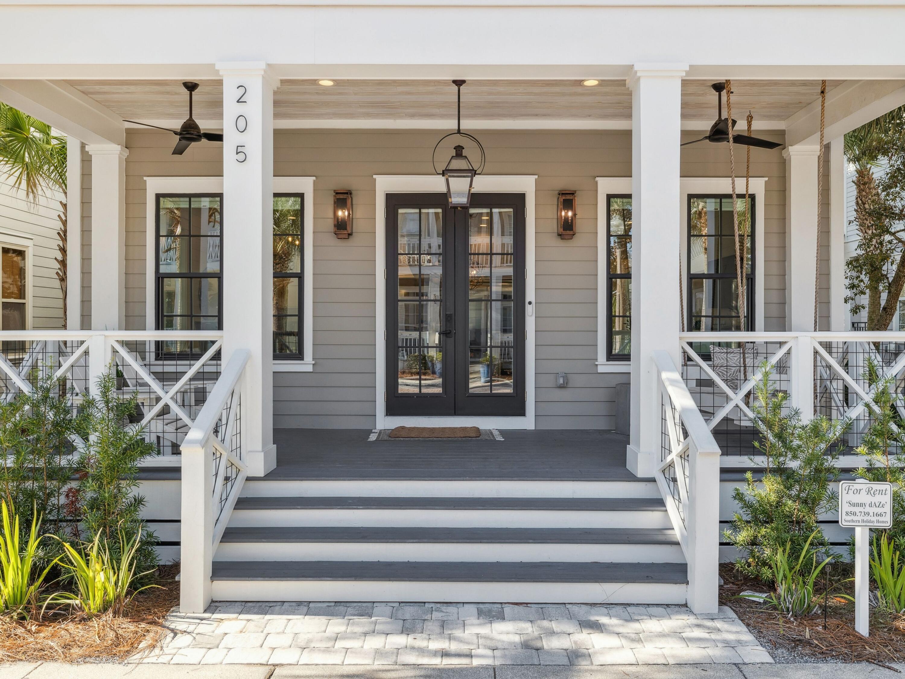 205 Seacrest Beach Boulevard Seacrest, FL 32461 - Photo 11 of 39 a front view of a house with a porch