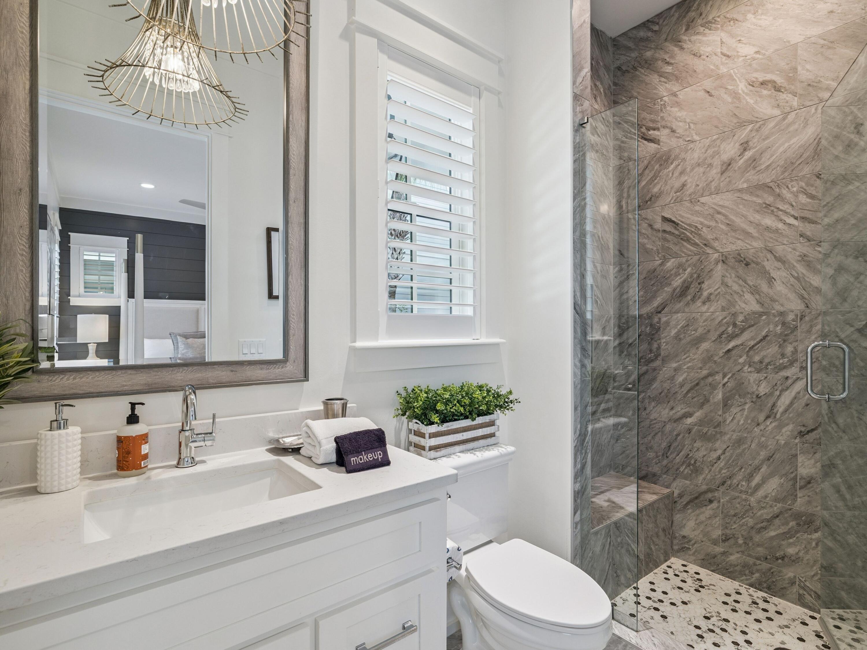 205 Seacrest Beach Boulevard Seacrest, FL 32461 - Photo 18 of 39 a bathroom with a sink a toilet and shower