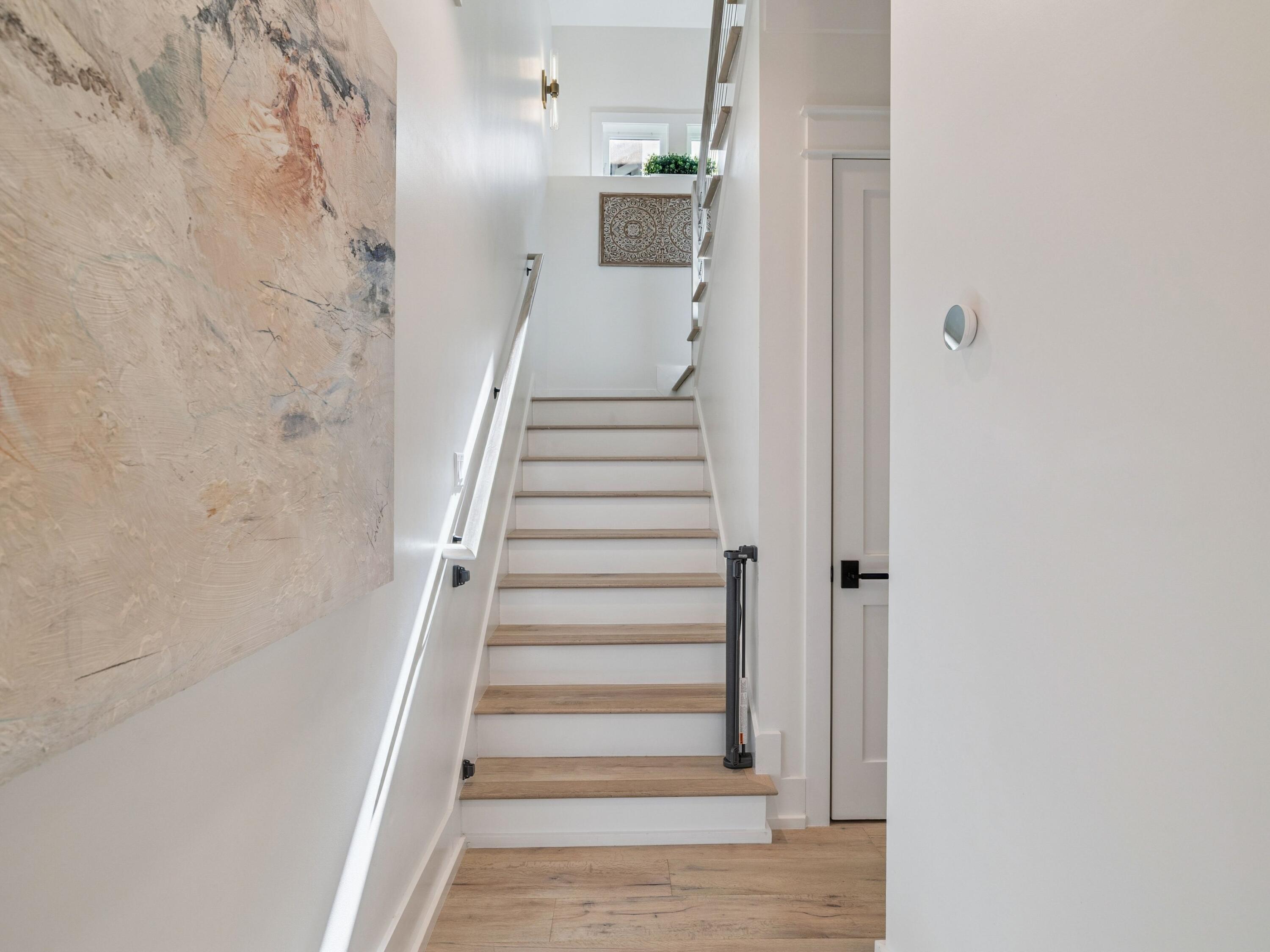 205 Seacrest Beach Boulevard Seacrest, FL 32461 - Photo 19 of 39 a view of a hallway with a white walls and stairs