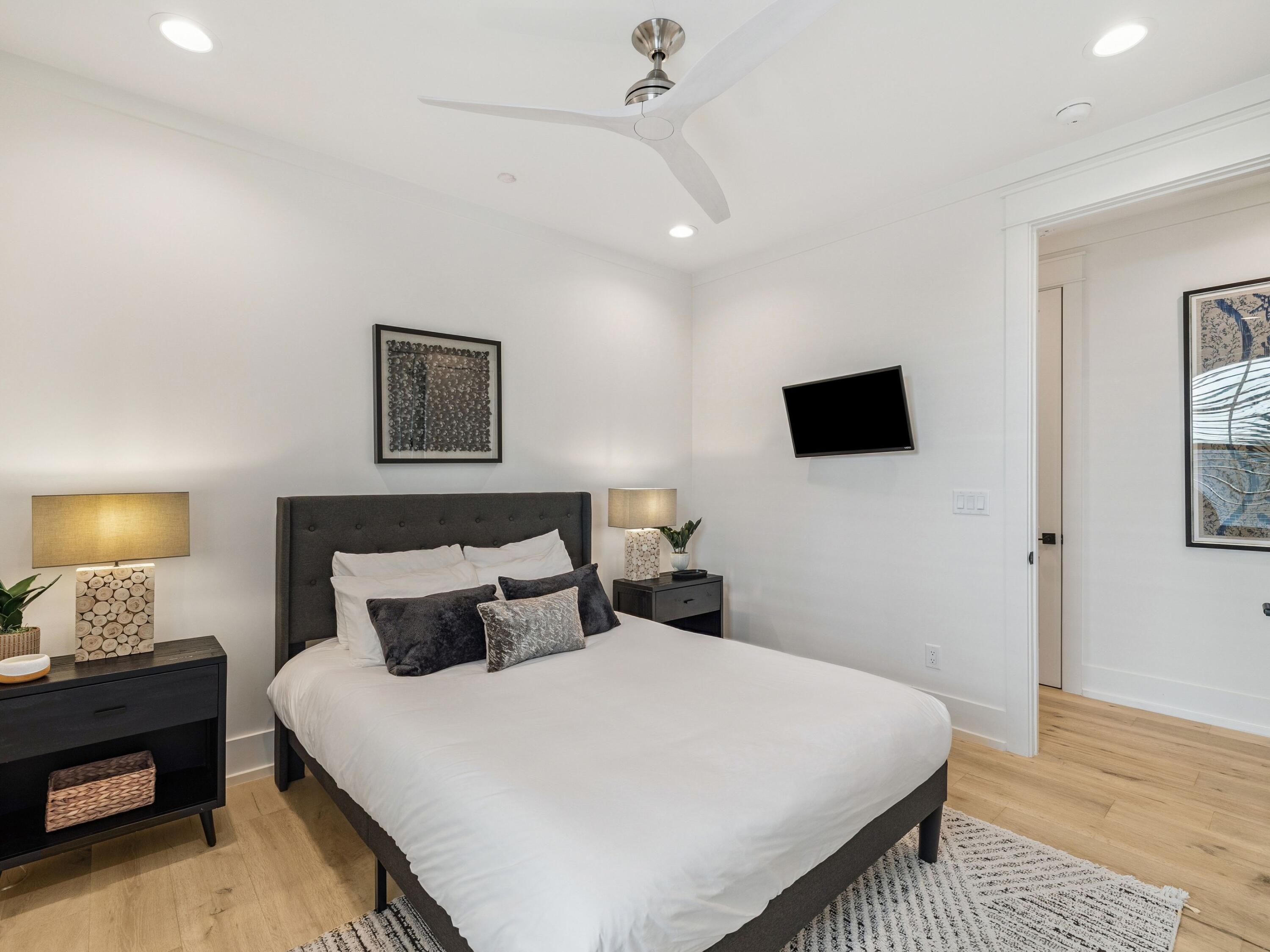 205 Seacrest Beach Boulevard Seacrest, FL 32461 - Photo 24 of 39 a bedroom with a bed and a tv