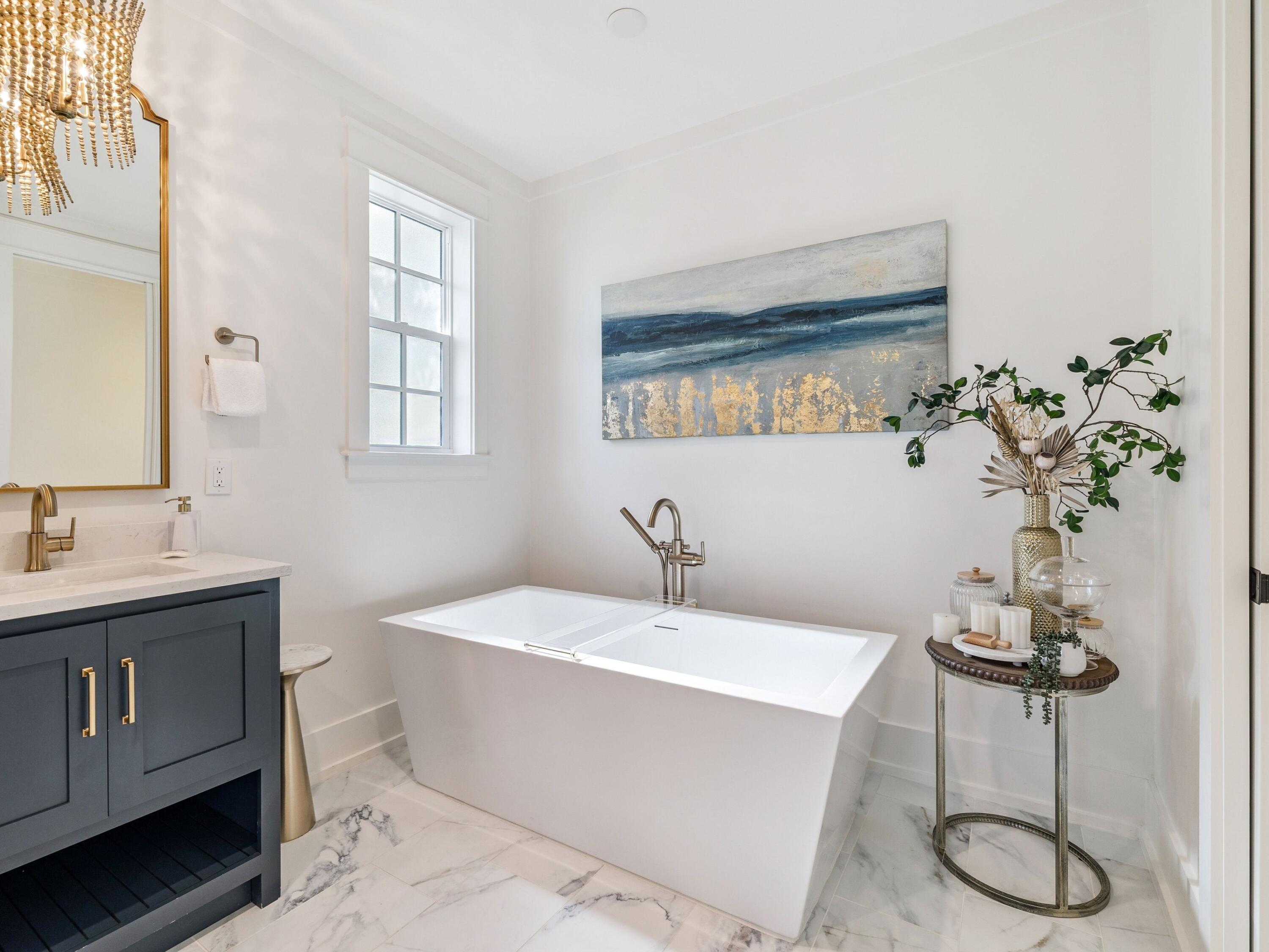 205 Seacrest Beach Boulevard Seacrest, FL 32461 - Photo 27 of 39 a bathroom with a bathtub a sink and a window