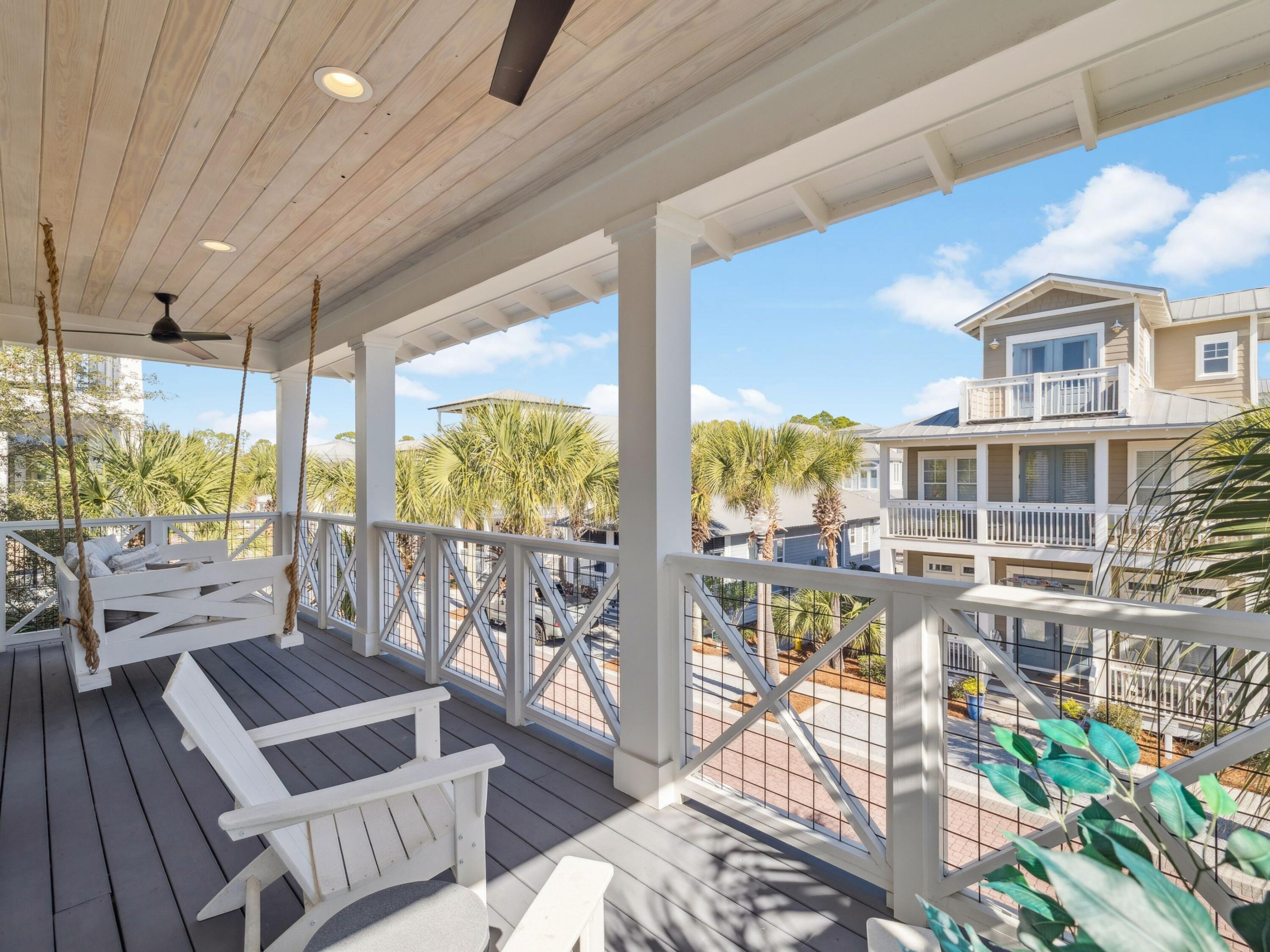 205 Seacrest Beach Boulevard Seacrest, FL 32461 - Photo 29 of 39 a living room with patio furniture and a floor to ceiling window