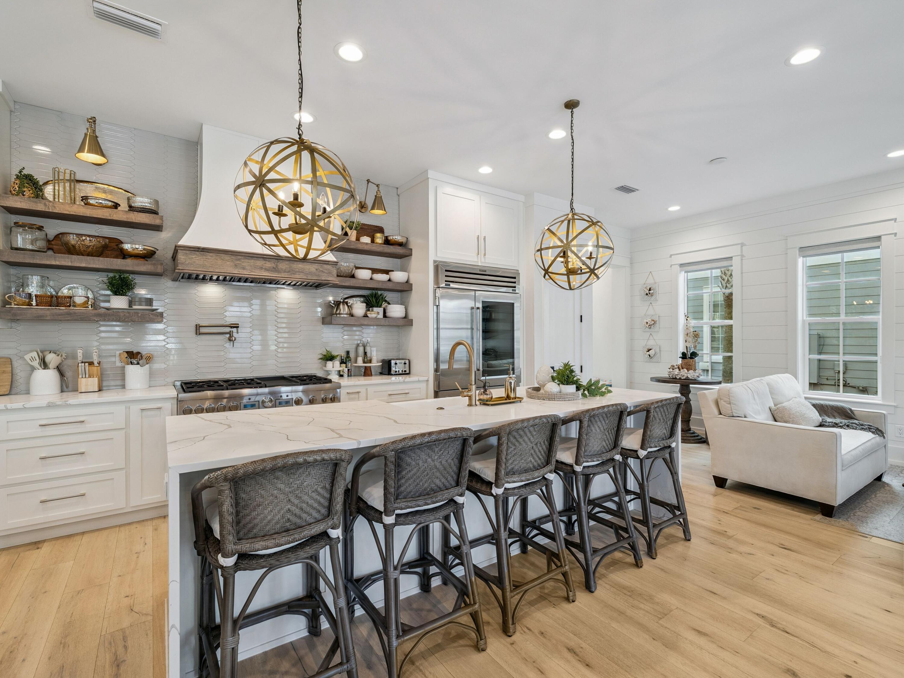 205 Seacrest Beach Boulevard Seacrest, FL 32461 - Photo 3 of 39 a large kitchen with a table and chairs