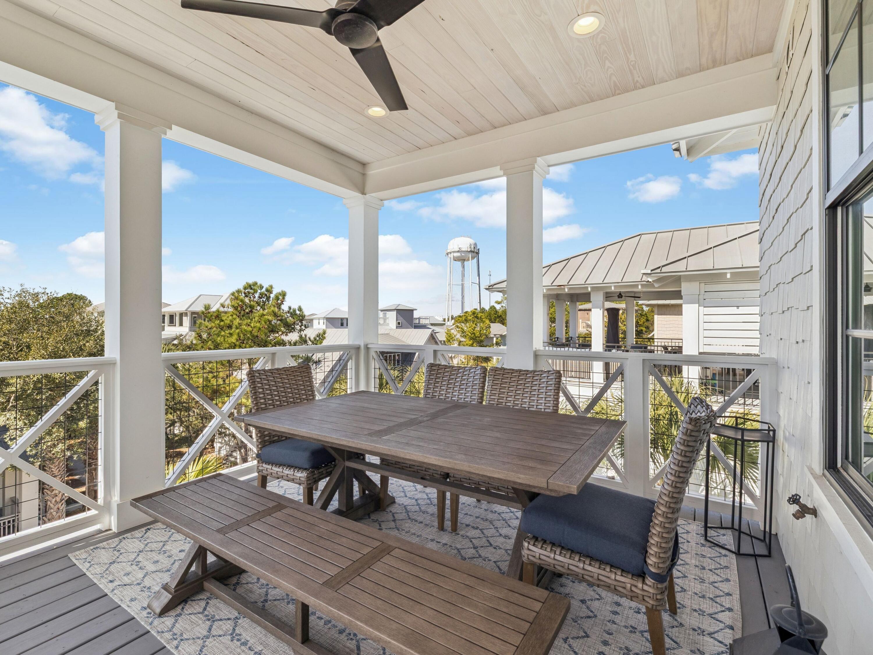 205 Seacrest Beach Boulevard Seacrest, FL 32461 - Photo 34 of 39 a view of a dining room with furniture window and wooden floor
