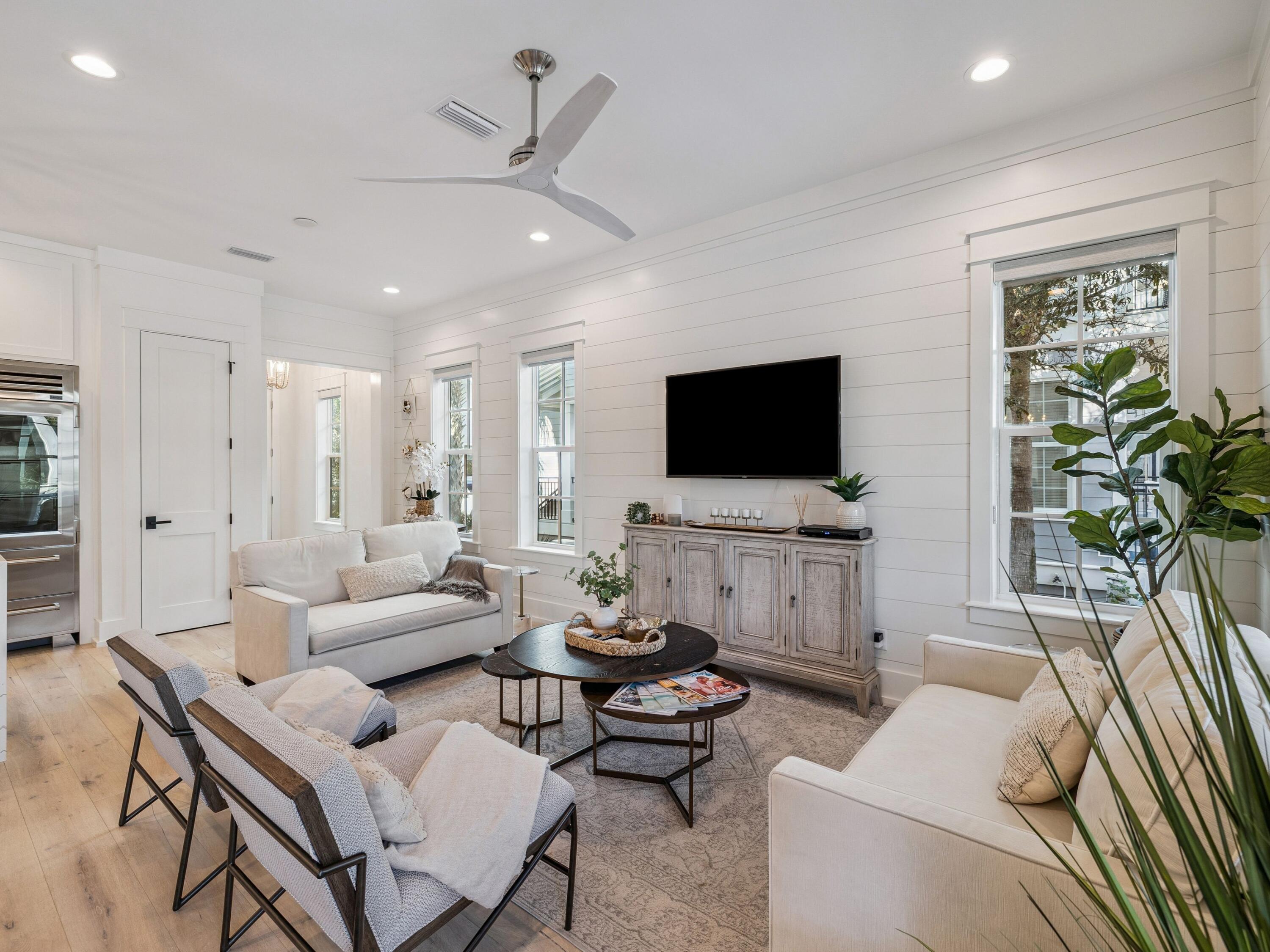 205 Seacrest Beach Boulevard Seacrest, FL 32461 - Photo 4 of 39 a living room with furniture and a flat screen tv