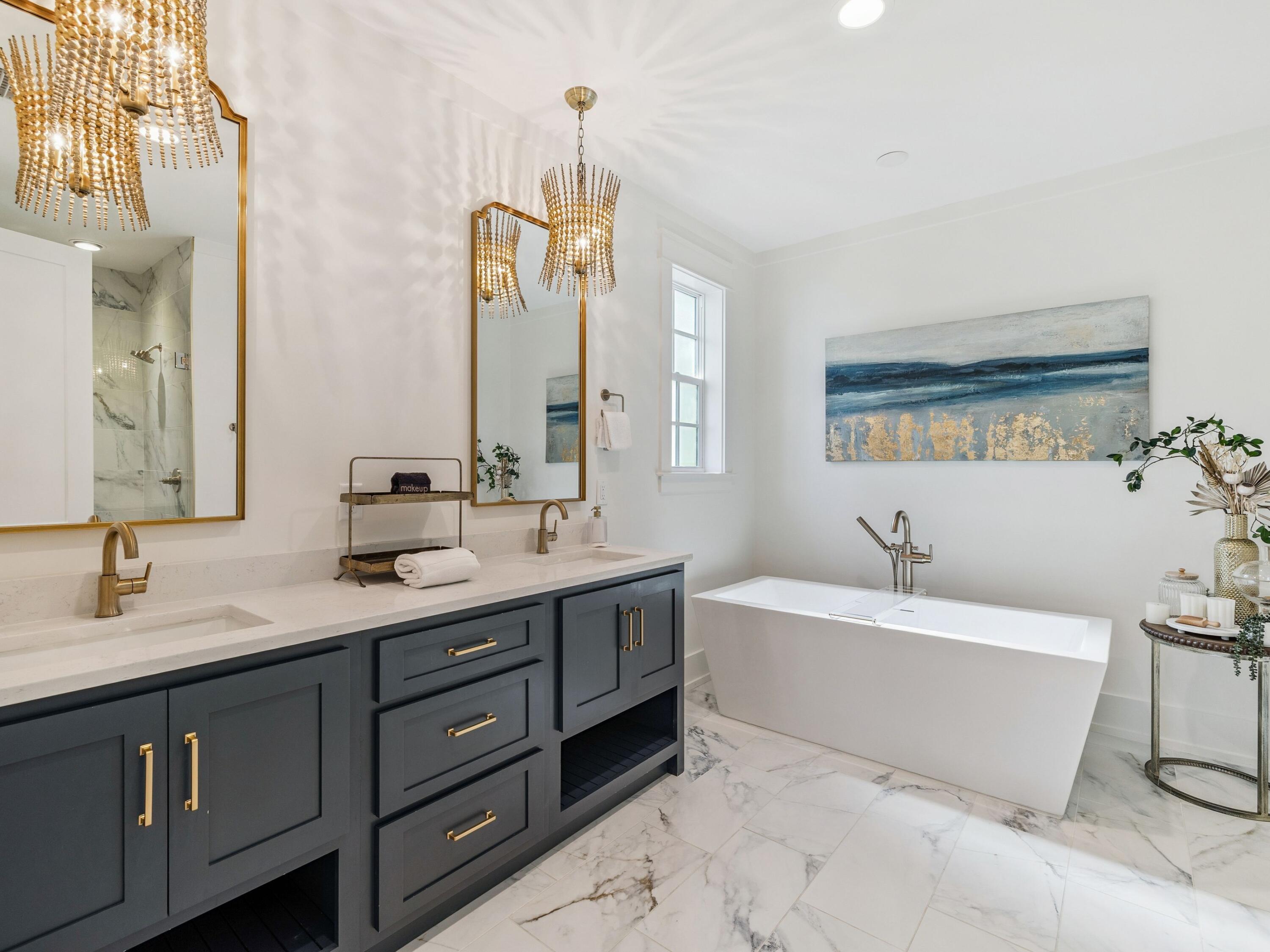 205 Seacrest Beach Boulevard Seacrest, FL 32461 - Photo 6 of 39 a bathroom with a tub sink double vanity and mirror