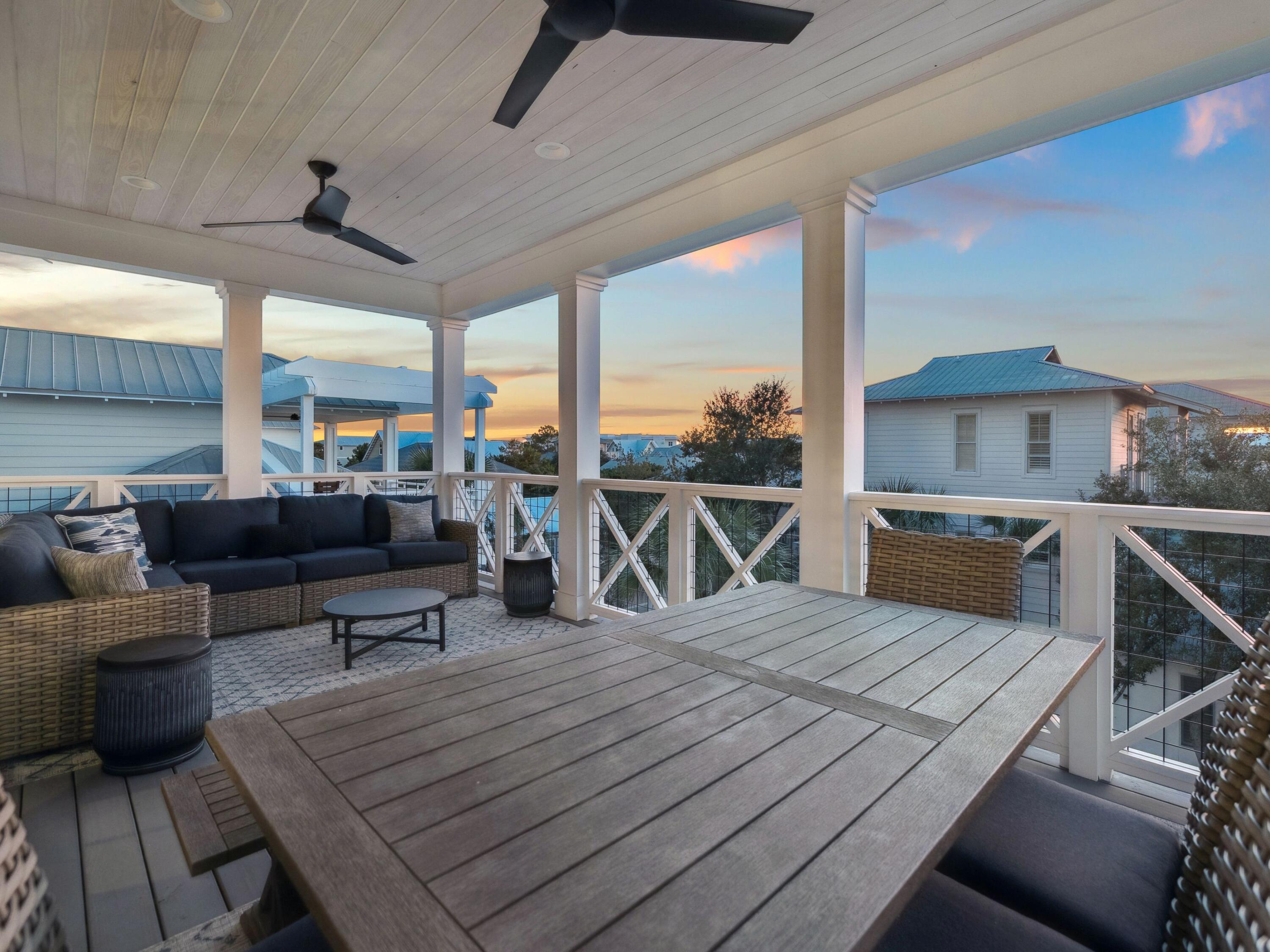 205 Seacrest Beach Boulevard Seacrest, FL 32461 - Photo 8 of 39 a living room with stainless steel appliances kitchen island granite countertop furniture and a kitchen view