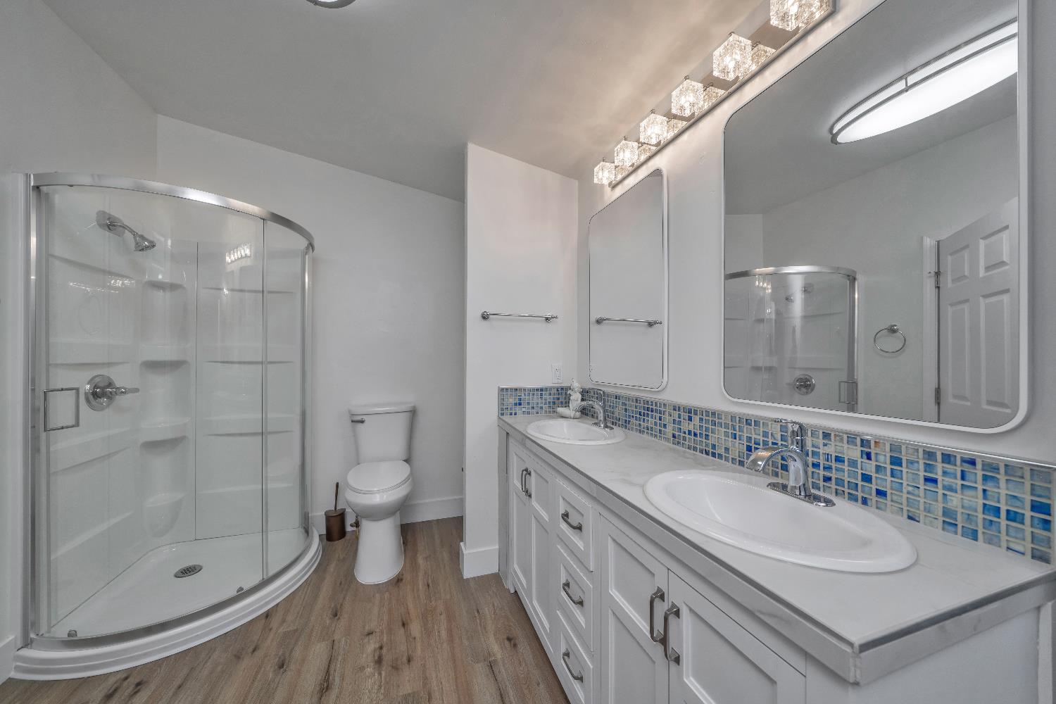 4420 Pleasant Valley Road, Unit 155 Diamond Springs, CA 95619 - Photo 25 of 42 a bathroom with a sink a toilet and shower