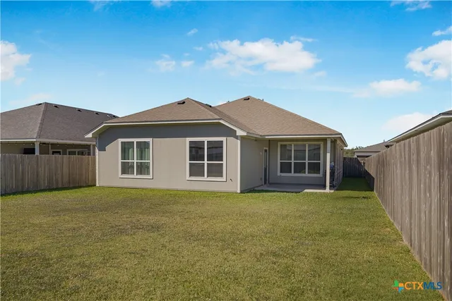 a front view of a house with yard porch and seating space