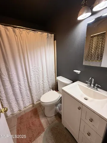 a bathroom with a sink toilet and vanity
