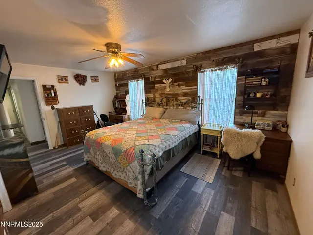 a bedroom with a bed window and a couch