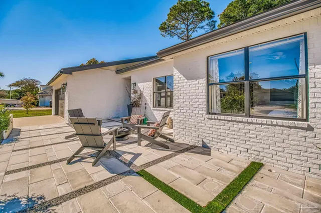 a view of a patio on the deck front of house