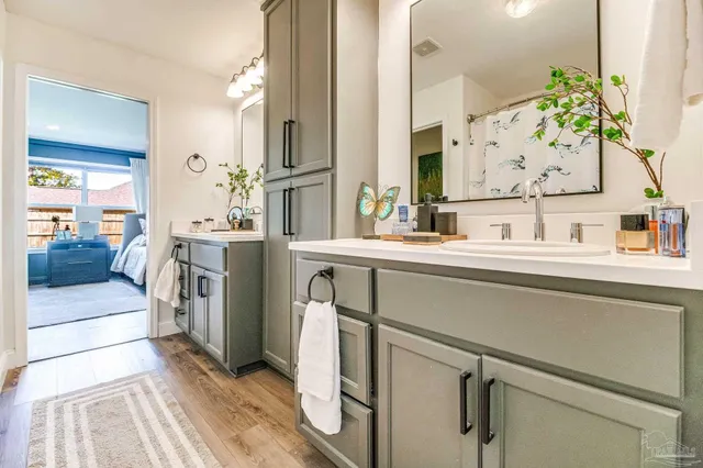 a bathroom with a sink and a mirror