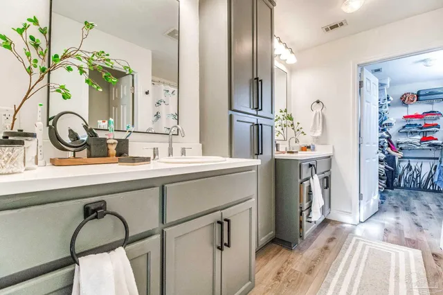 a bathroom with a sink and a mirror