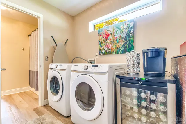a view of a hallway with washer and dryer