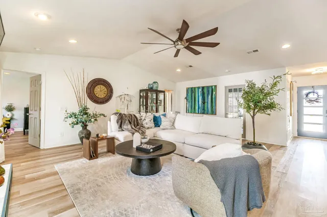 a living room with furniture and a large window