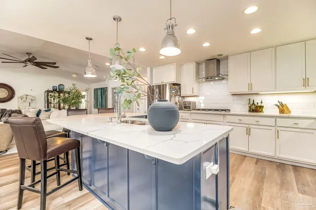 a kitchen with a table and chairs in it