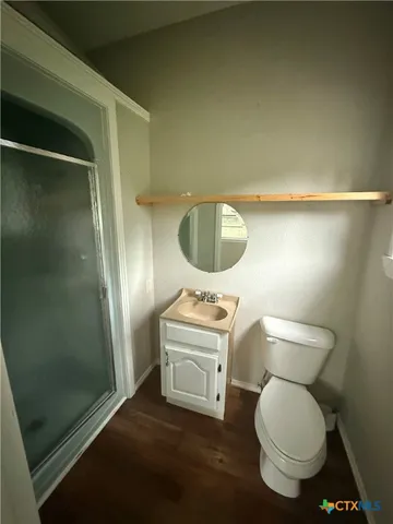 a view of bathroom with bathtub and wooden floor