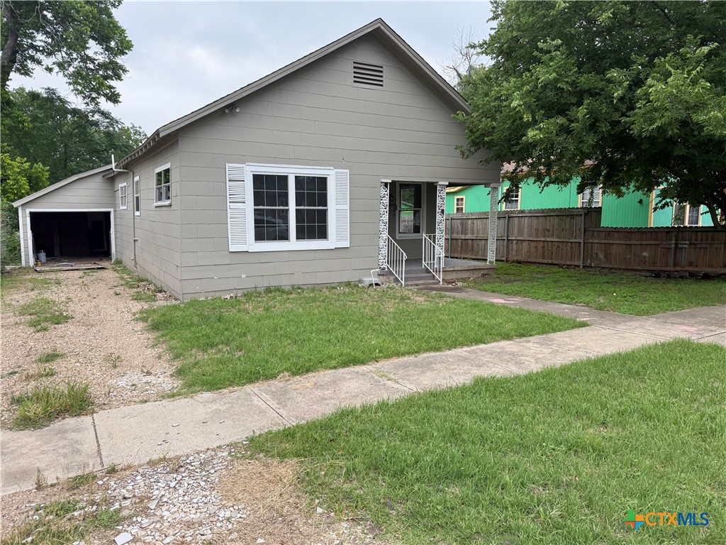 203 South 27th Street Temple, TX 76504 - Photo 2 of 15 a front view of a house with a yard and porch