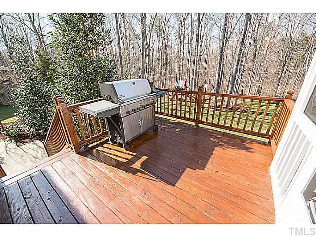 208 Okamato Street Raleigh, NC 27603 - Photo 20 of 25 Deck and patio overlook amazing backyard!