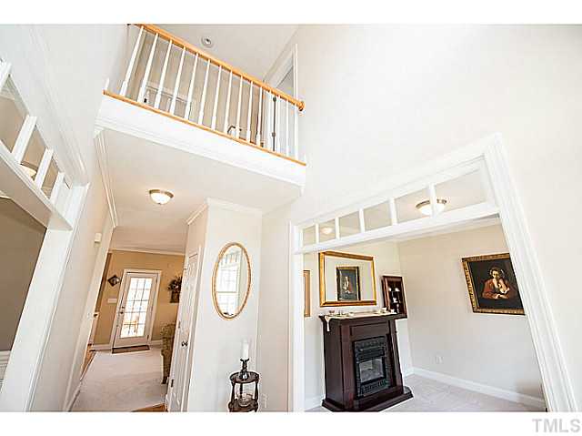 208 Okamato Street Raleigh, NC 27603 - Photo 3 of 25 A view of the second floor overlook from the two-story foyer.